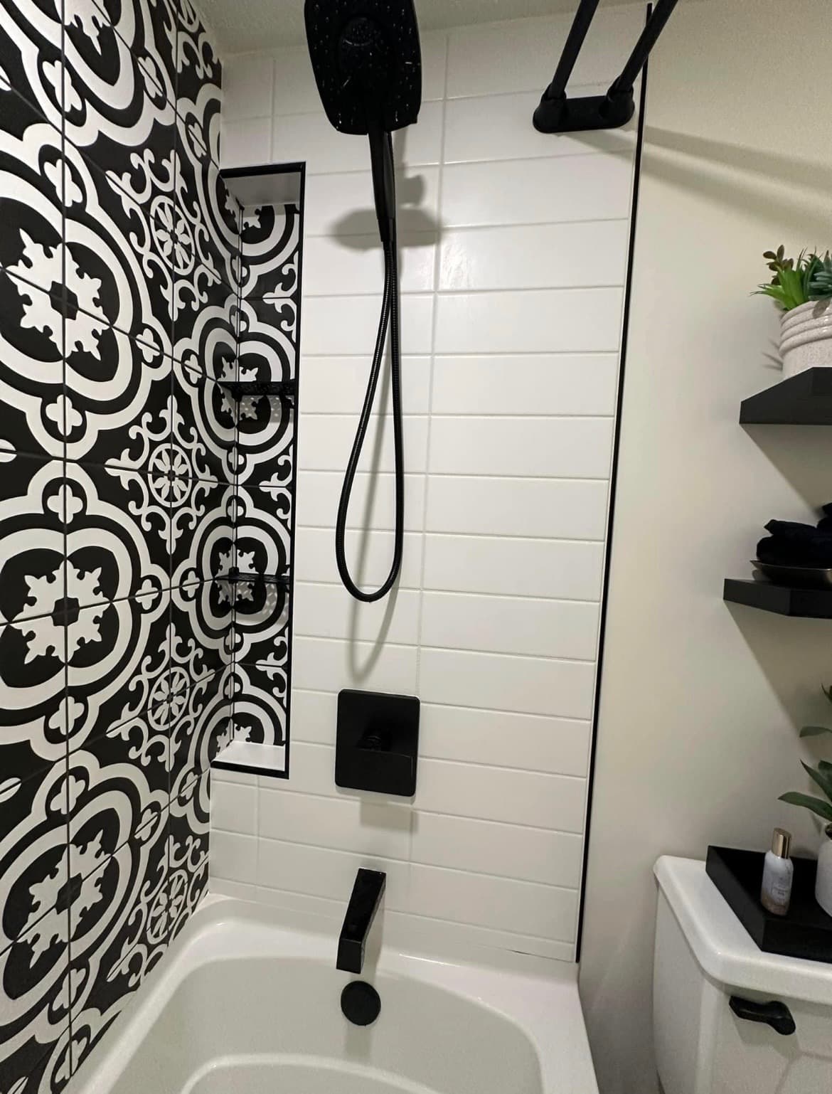 Bathtub surround with decorative accent wall tile detail in Temecula bathroom remodel