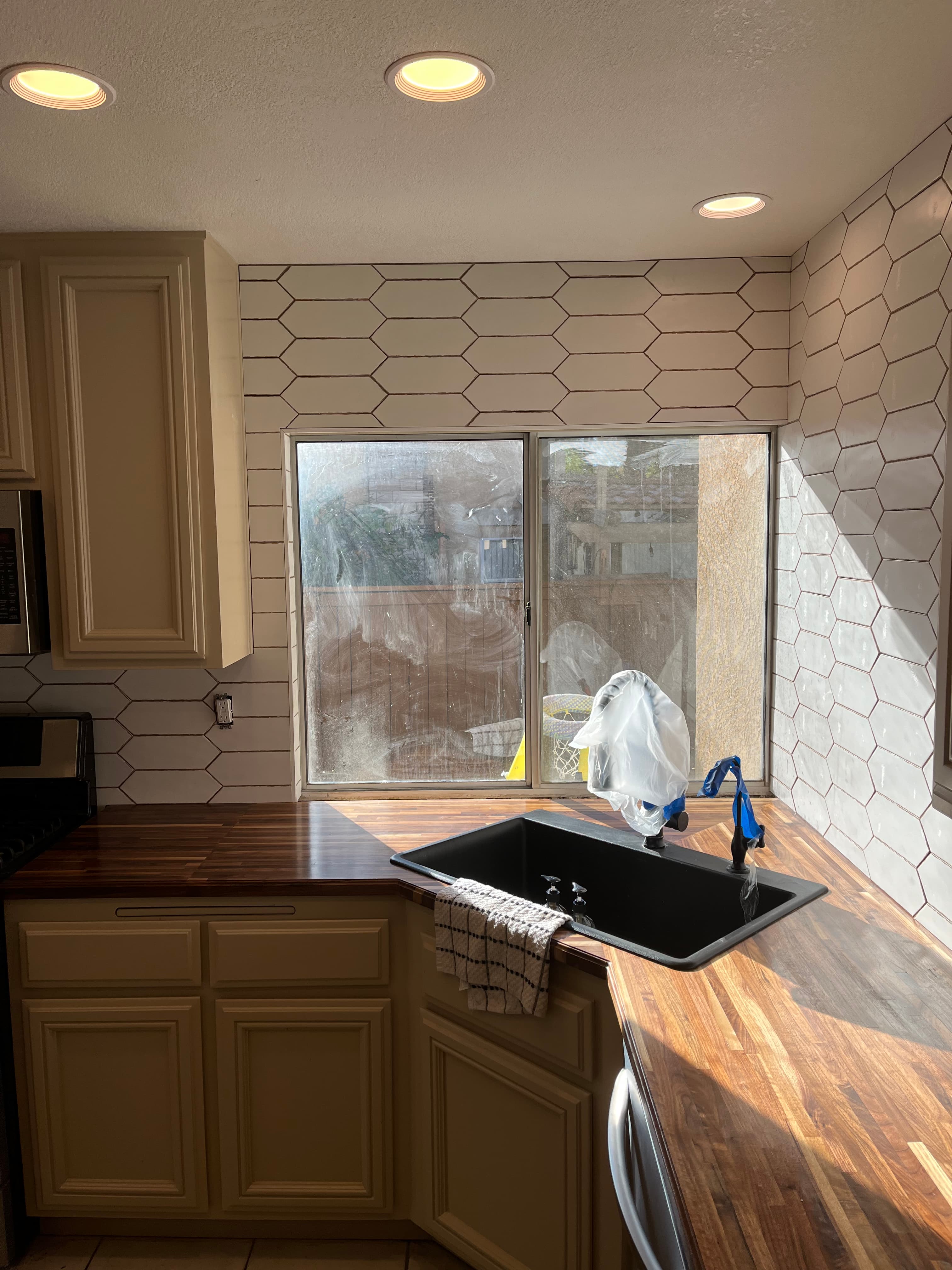 Modern kitchen with wrap-around hexagon tile backsplash installation in Menifee