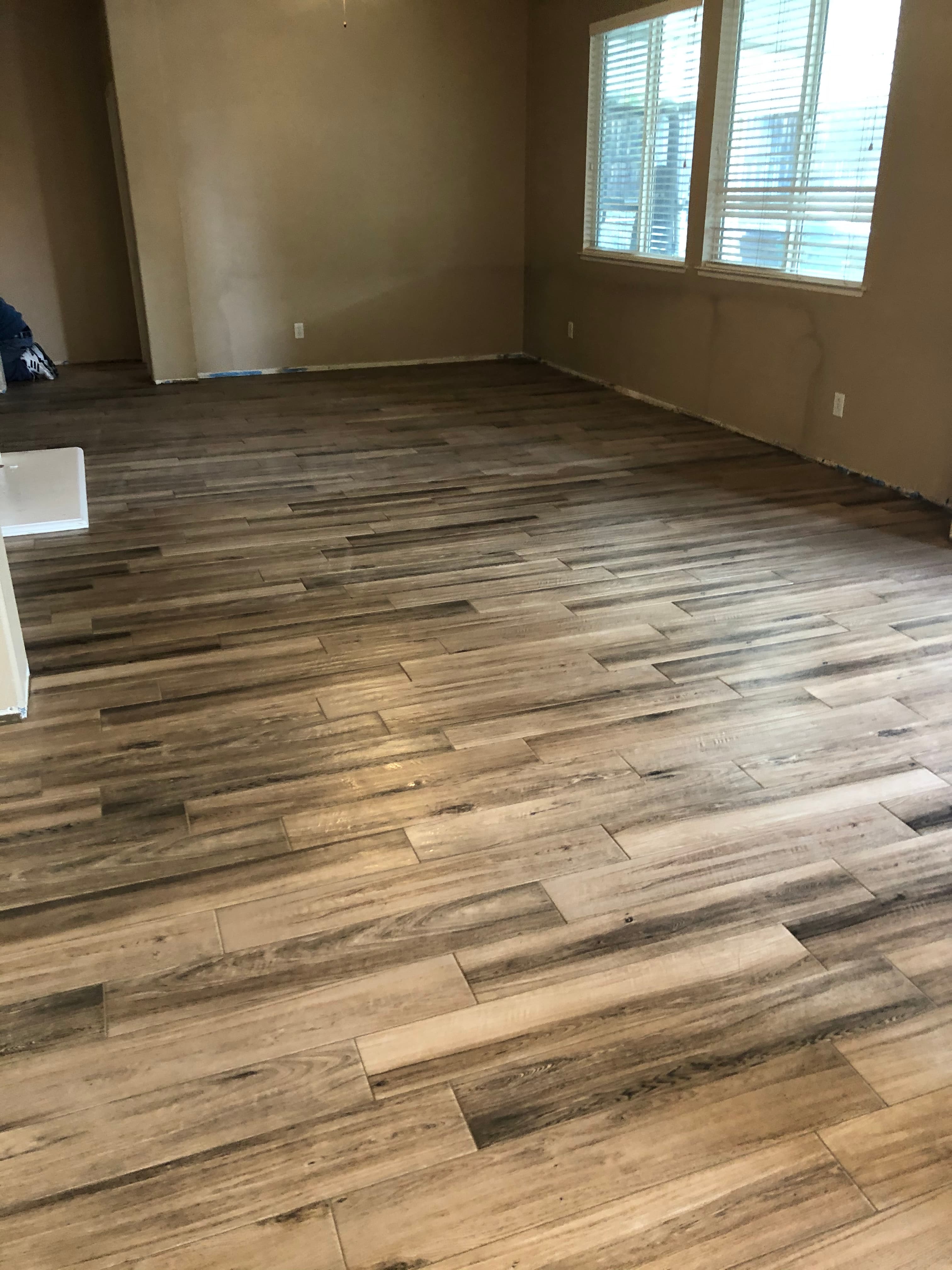 Seamless large format tile floor design in Los Angeles luxury residence