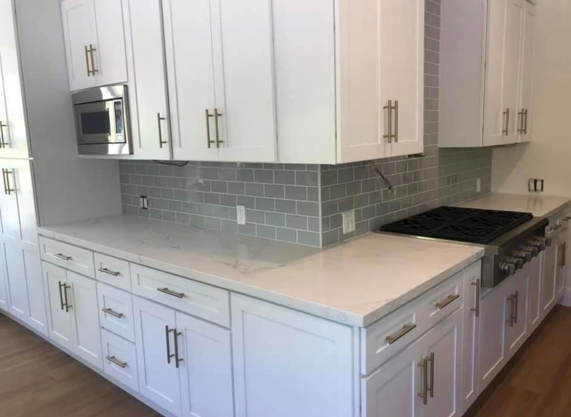 Full-height tile backsplash installation in Newport Beach kitchen